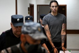 US basketball player Brittney Griner, who was detained at Moscow's Sheremetyevo airport and later charged with illegal possession of cannabis, is escorted in a court building in Khimki outside Moscow