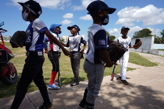 Children chat before baseball practice in Havana
