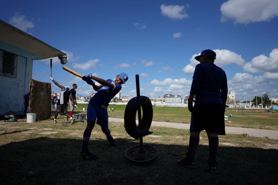 Baseball players practice during a training session in Havana