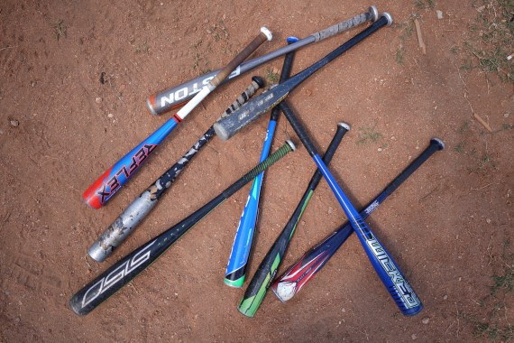 Baseball bats lay on a field during a training session in Havana