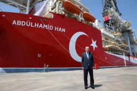 Turkish President Recep Tayyip Erdogan poses with Turkey&#39;s new drill ship Abdulhamid Han at Tasucu port in the Mediterranean Turkish city of Mersin [Presidential Press Office/Handout via Reuters]