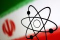 The atomic symbol and the Iranian flag are seen in this illustration