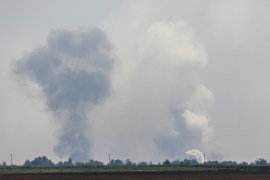 Smoke rises following an explosion in the village of Mayskoye in the Dzhankoi district of Crimea on August 16, 2022 [Reuters]