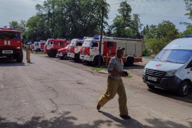 Firefighting and ambulance vehicles are seen in Azovskoye settlement in Russian-annexed Crimea following an explosion at a Russian military warehouse [Reuters]
