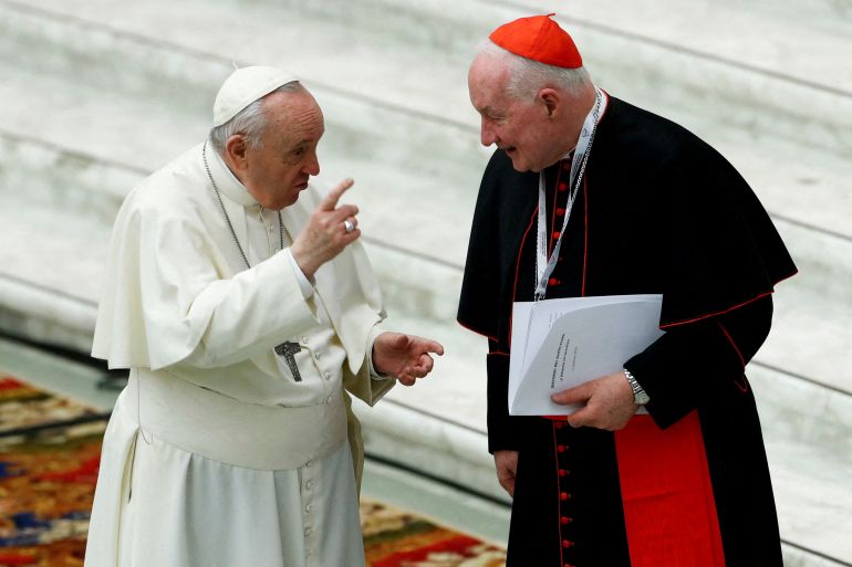 Pope Francis (left) talks to Cardinal Marc Ouellet