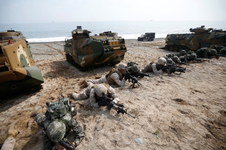 US and South Korean marines participate in a US-South Korea joint beach landing operation drill in Pohang, South Korea, March 31, 2014.