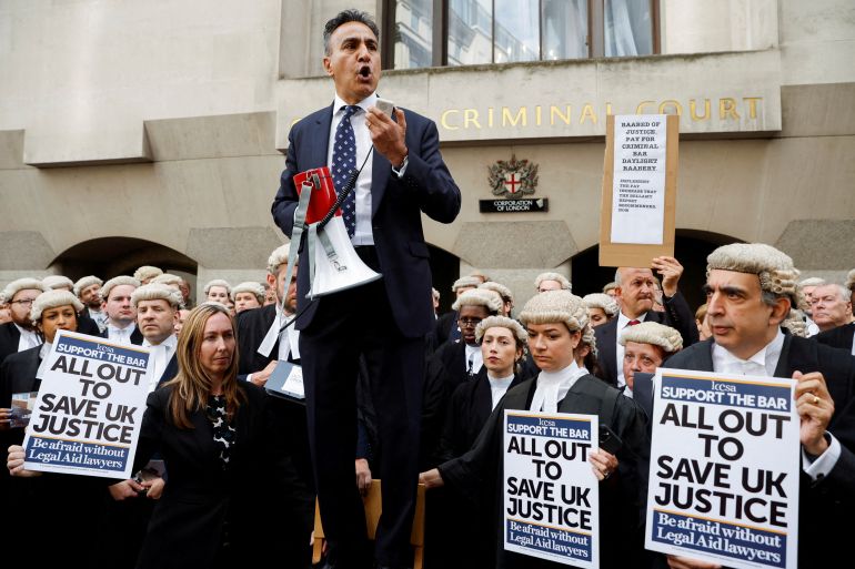 Jo Sidhu, Chair of the Criminal Bar Association, speaks during a strike by criminal barristers