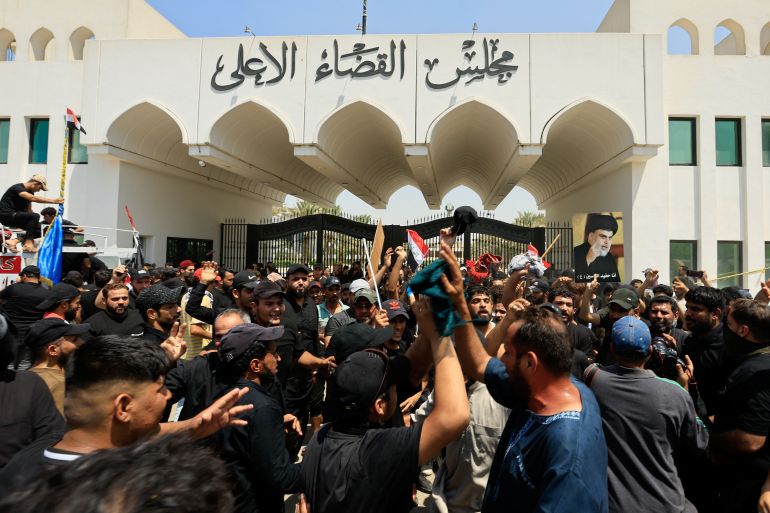 Supporters of Iraqi populist leader Moqtada al-Sadr gather for a sit-in in front of the gate of Supreme Judicial Council of Iraq, amid political crisis in Baghdad, Iraq