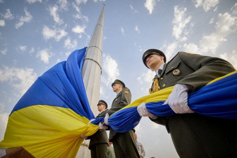 Members of the Honour Guard attend a rising ceremony of the Ukraine's biggest national flag to mark the Day of the State Flag, amid Russia's attack on Ukraine, in Kyiv, Ukraine August 23, 2022.