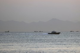 A Taiwan Coast Guard ship travels past the coast of China, in the waters off Nangan island of Matsu archipelago in Taiwan