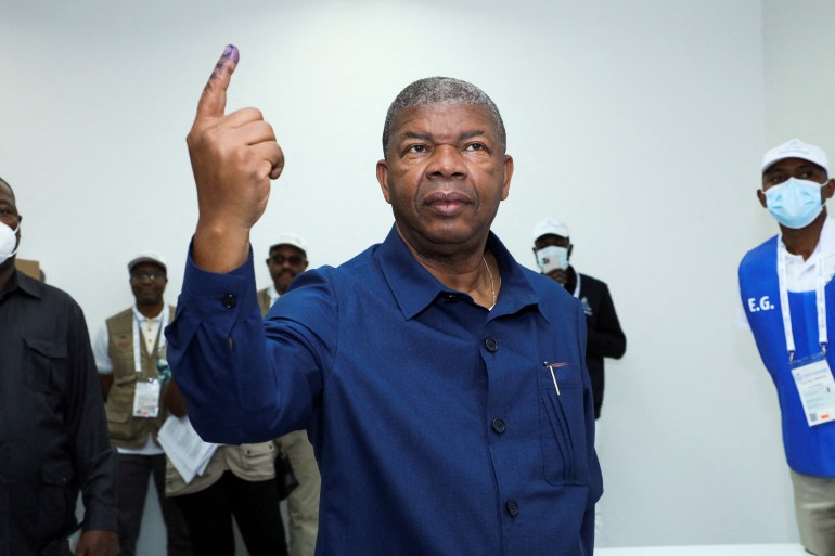 Angola's President and leader of the People's Movement for the Liberation of Angola (MPLA) ruling party Joao Lourenco gestures after casting his vote in a general election in the capital Luanda, Angola August 24, 2022.