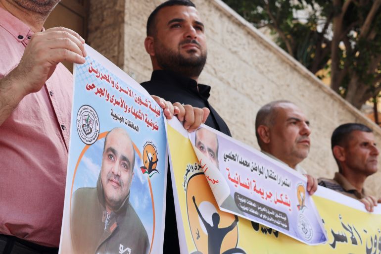 People hold pictures of Mohammad al-Halabi