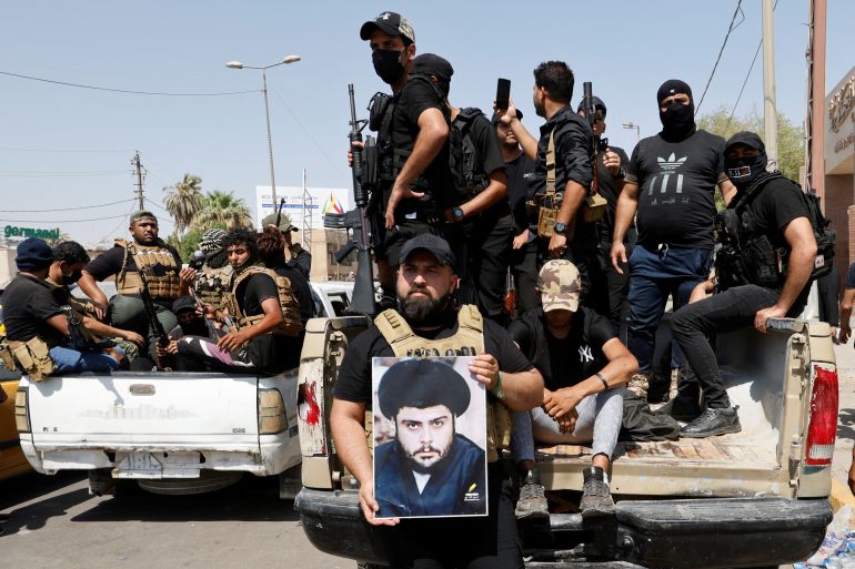 Followers of Iraqi leader Moqtada al-Sadr withdraw from the streets after violent clashes.
