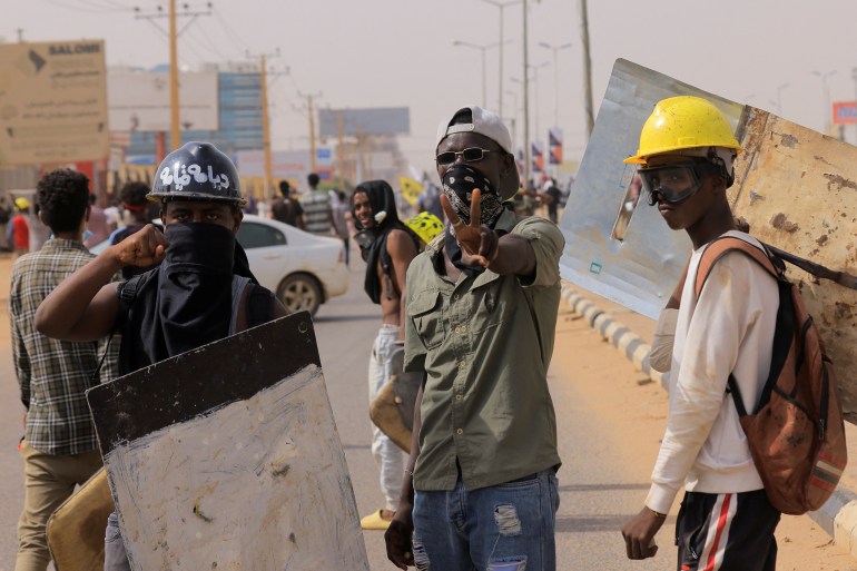 Protesters march during a rally against military rule in Sudan