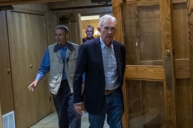 Jerome Powell leaves the reception dinner at the Jackson Hole economic symposium in Moran, Wyoming