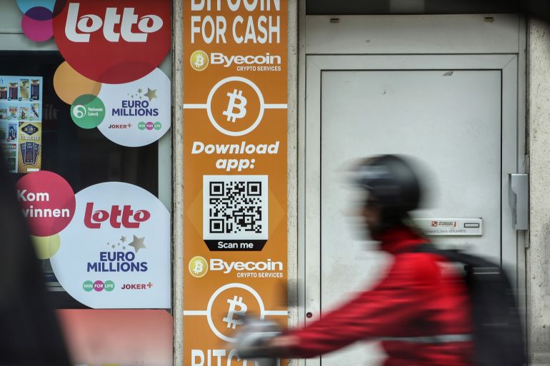 Bitcoin and the Byecoin app are advertised in the window of a store in Antwerp, Belgium
