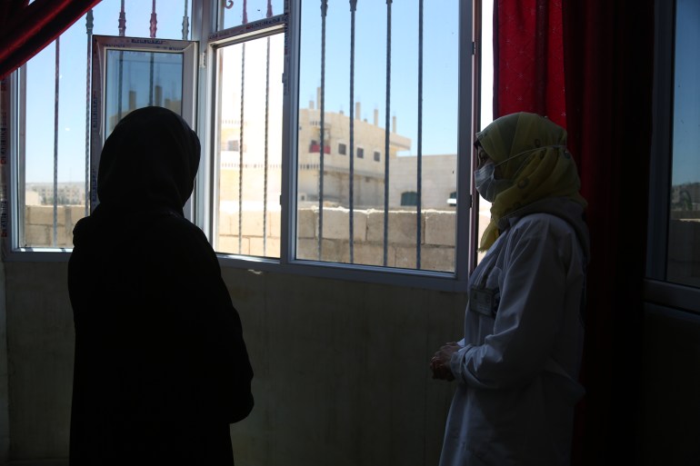 A health professional and a patient at a mental health clinic in Idlib