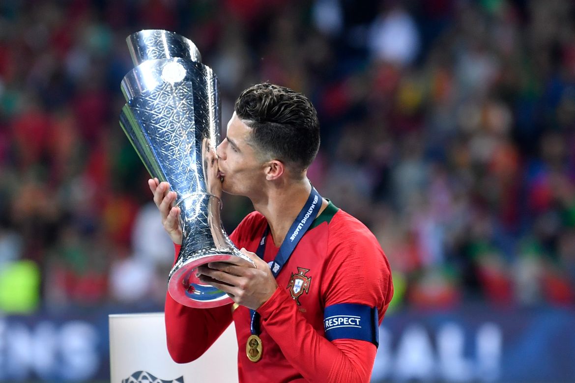 Portugal's Cristiano Ronaldo kisses the trophy