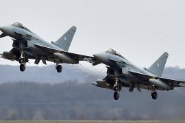 Two Eurofighter jets perform at the German air force base in Noervenich, western Germany in 2016 [File: Martin Meissner/AP]