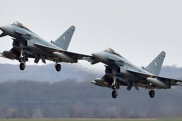 Two Eurofighter jets perform at the German Air Force Base in Noervenich, western Germany in 2016 [Martin Meissner/AP]
