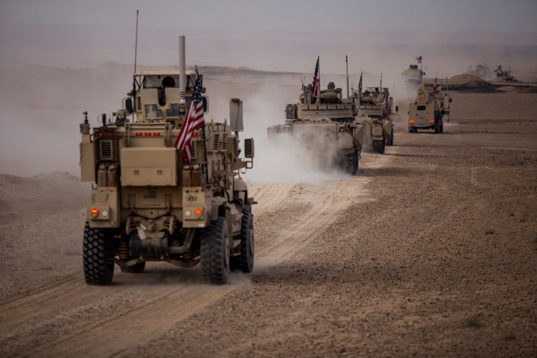 American military convoy rides during a joint exercise with Syrian Democratic Forces at the countryside of Deir Ezzor in northeastern Syria