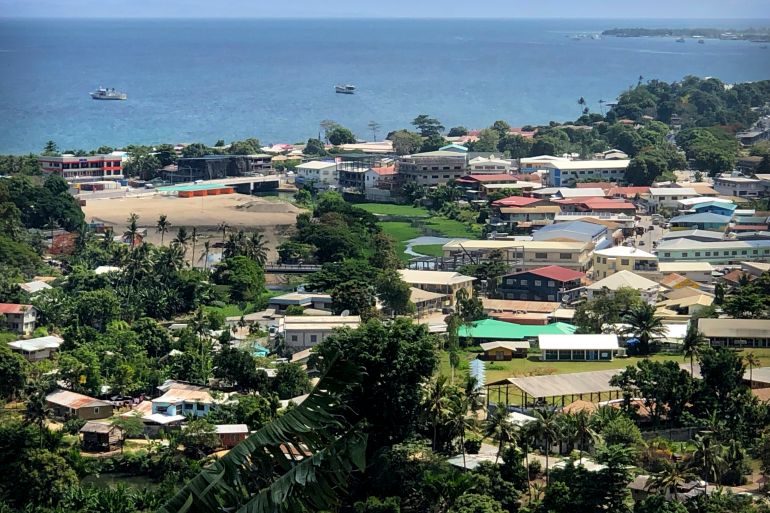 Aerial view of Honiara, showing the sea in the distance.