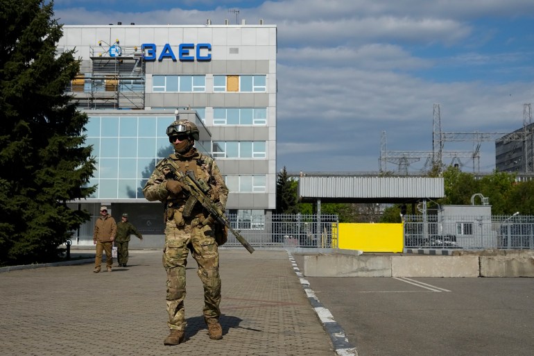 A Russian serviceman stands guard in an area of the Zaporizhzhia Nuclear Power Station in territory under Russian military control, southeastern Ukraine
