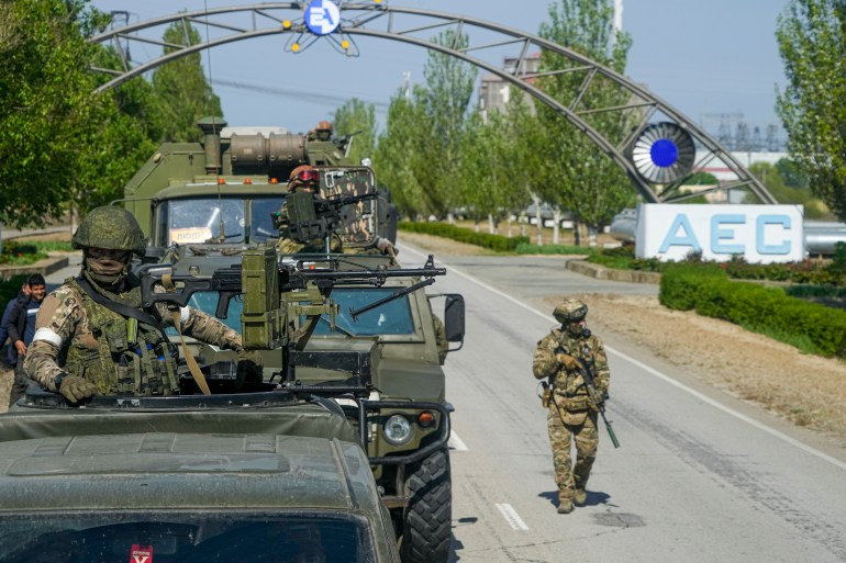 Russian military convoy stands on the road toward the Zaporizhzhia Nuclear Power Station, the largest nuclear power plant in Europe and among the 10 largest in the world in Enerhodar, Zaporizhzhia region, in territory under Russian military control, southeastern Ukraine, Sunday, May 1, 2022. (AP Photo)