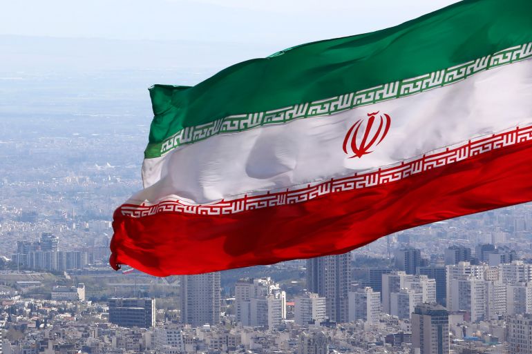 Iran's national flag waves in Tehran.
