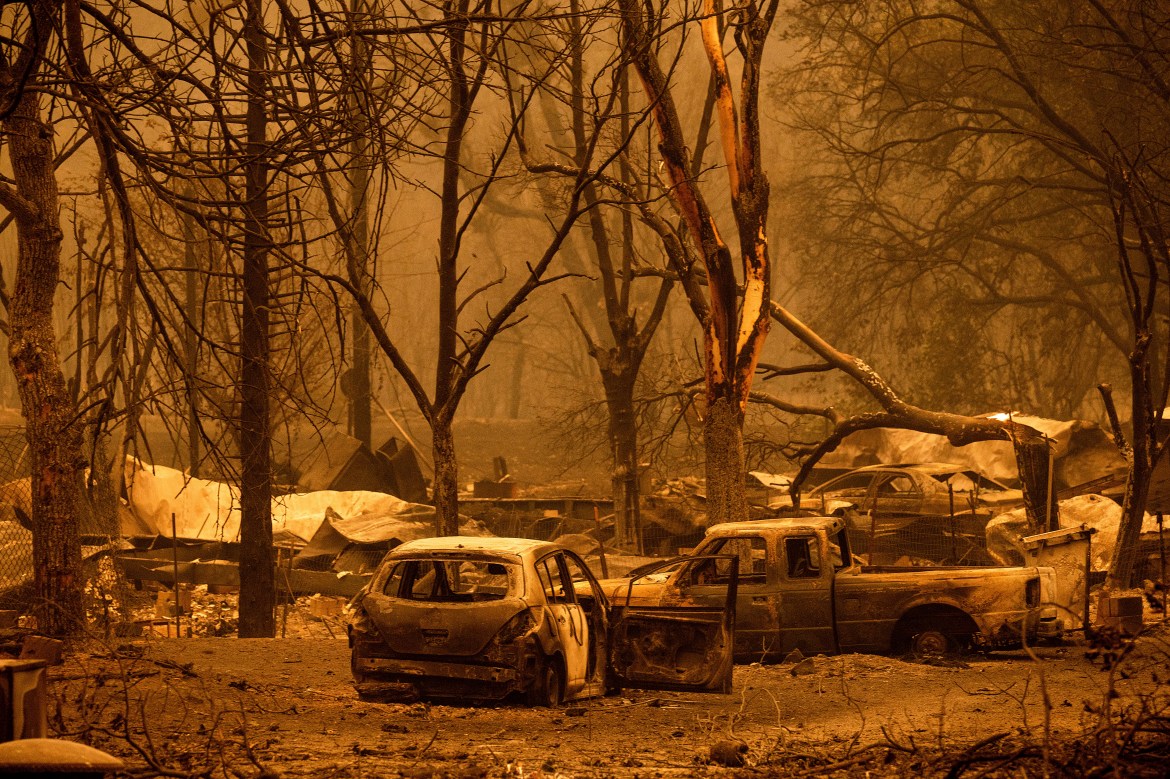 Scorched vehicles and residences line the Oaks Mobile Home Park in the Klamath River community as the McKinney Fire burns in Klamath National Forest