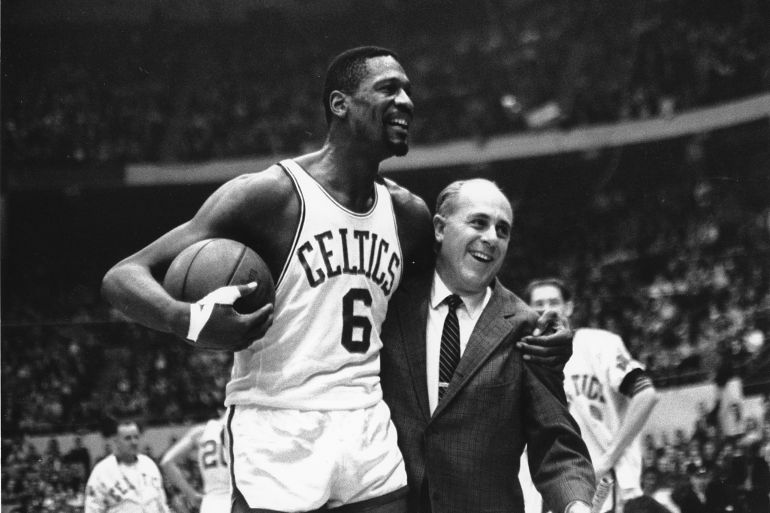 Bill Russell with his arm around his coach