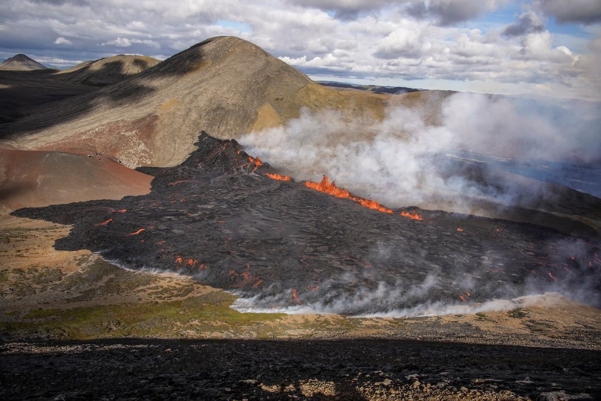 Steam rises and lava flows from Fagradalsfjall volcano