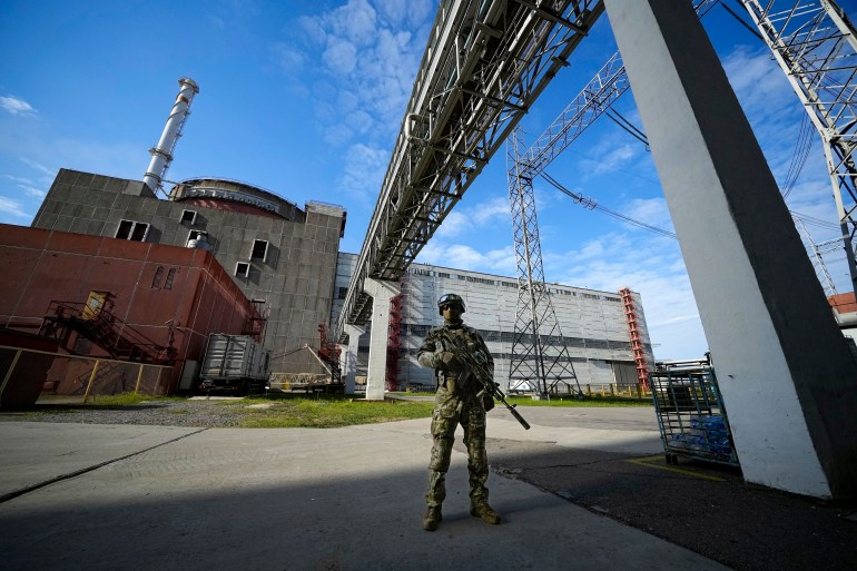 A Russian serviceman guards in an area of the Zaporizhzhia nuclear power plant.