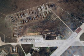A satellite image provided by Planet Labs PBC shows destroyed Russian aircraft at Saki Air Base in Crimea after a series of explosion Tuesday [Planet Labs PBC via the Associated Press]