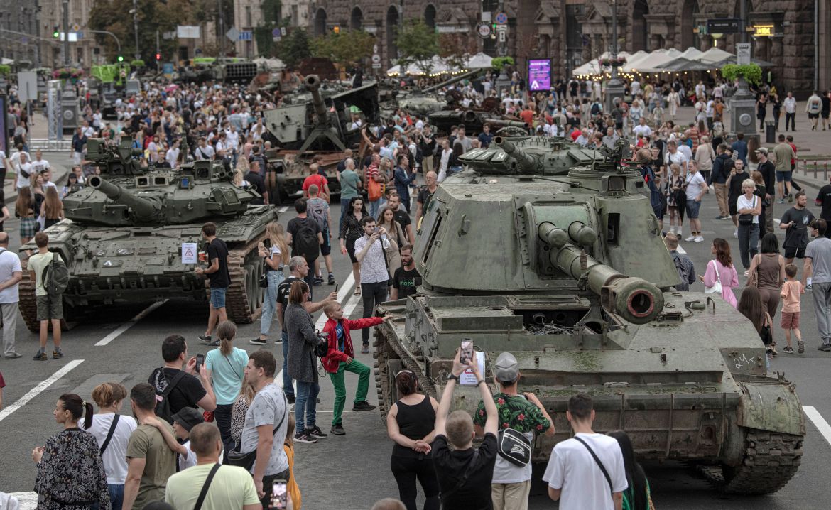 Ukrainians visit an avenue, where destroyed Russian military vehicles have been displayed in Kyiv, Ukraine