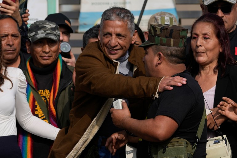 Former Army Major Antauro Humala greets supporters after he was released from prison, on the outskirts of Lima, Peru.