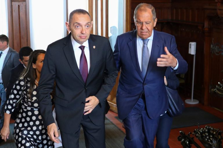 In this photo released by Russian Foreign Ministry Press Service, Serbia's Interior Minister Aleksandar Vulin, left, and Russia's Foreign Minister Sergei Lavrov walk during their meeting in Moscow, Russia, Monday, Aug. 22, 2022. (Russian Foreign Ministry Press Service via