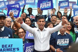 Rishi Sunak standing in front of supporters