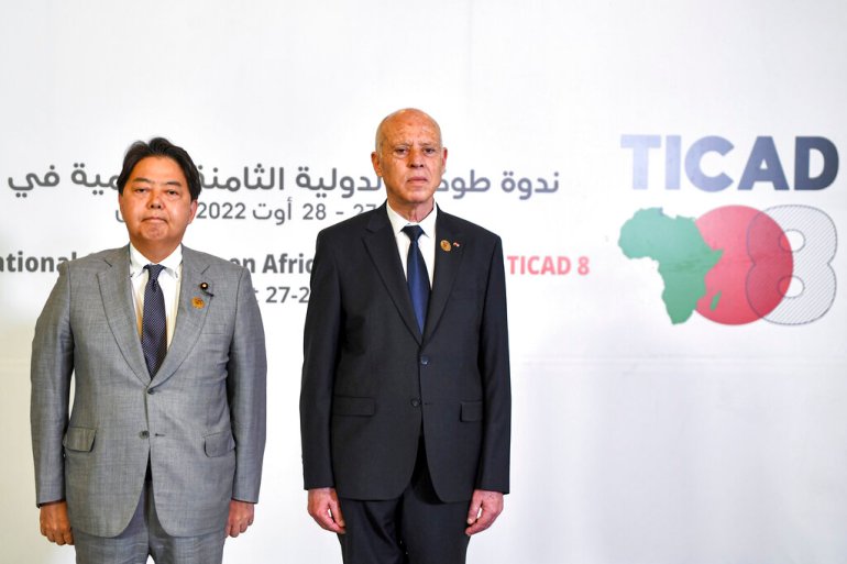 Tunisia's President Kais Saied, right, and Japan's Foreign Minister Yoshimasa Hayashi, left, pose for a photo during the eighth Tokyo International Conference on African Development (TICAD) in Tunisia's capital Tunis on Saturday, Aug. 27, 2022 [Fethi Belaid/pool via AP]