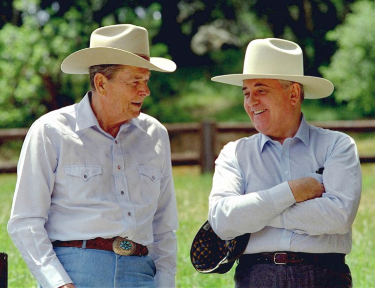 Ronald Reagan and Mikhail Gorbachev, dressed in cowboy hats at Reagan's California ranch in 1992