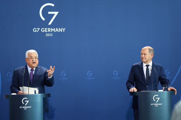 Palestinian President Mahmoud Abbas in Berlin alongside German Chancellor Olaf Schultz on August 16. Abbas accused Israel of committing "50 Holocausts" against the Palestinian people.