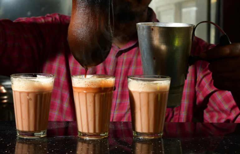Teamaker Salman adds a final droplet of decoction into samovar tea