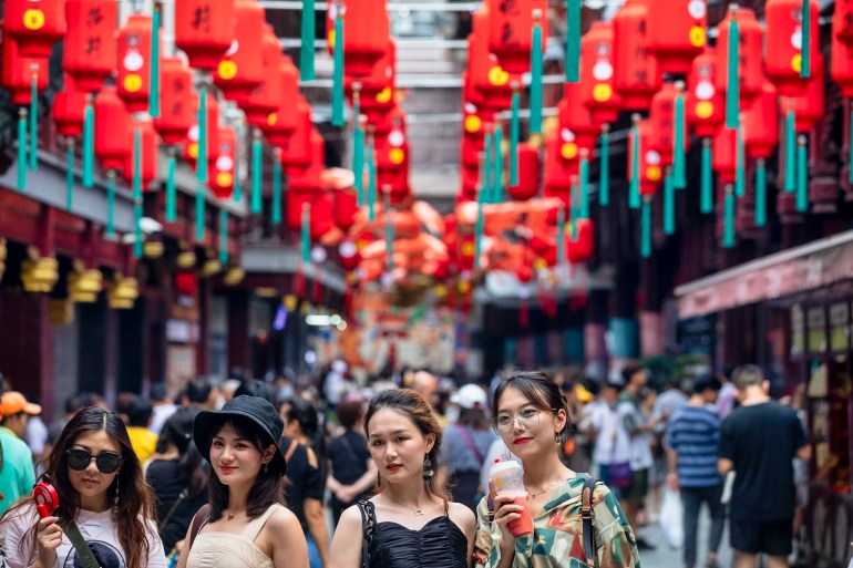 People walk in Shanghai, China