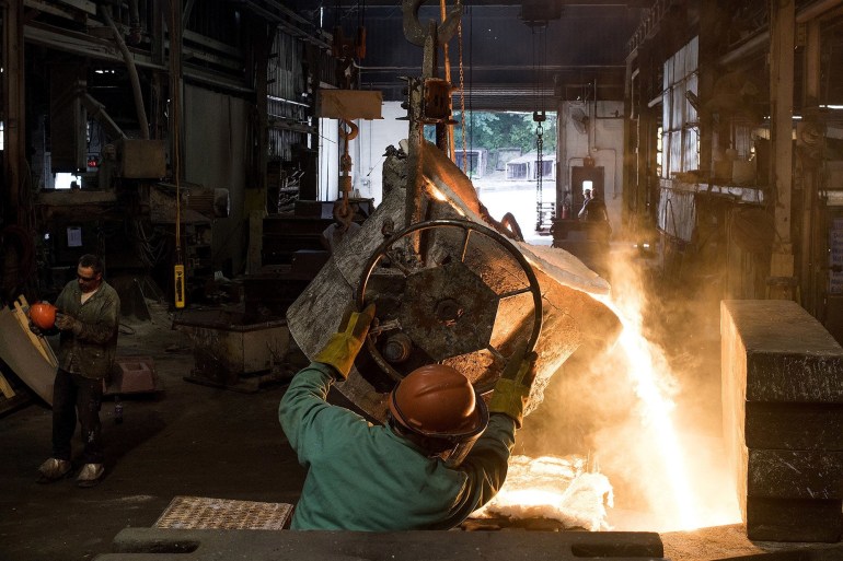 Molten steel is poured from a ladle into a large mold at a castings facility in Salem, Ohio