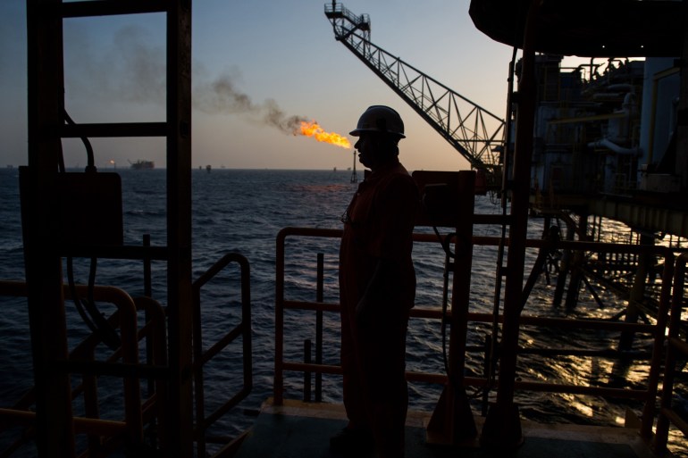 A gas flame burns from a pipe close to an offshore oil platform in the Persian Gulf's Salman Oil Field, operated by the National Iranian Offshore Oil Co., near Lavan island, Iran