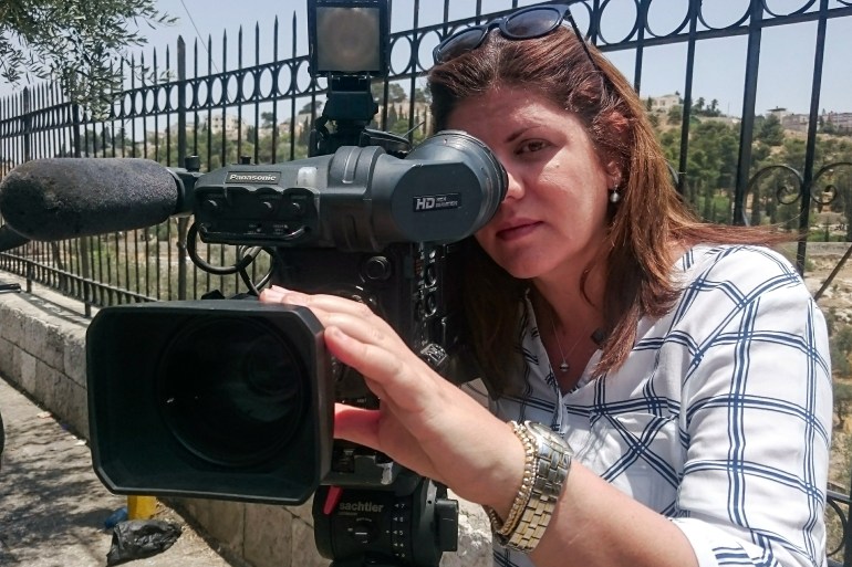 This handout file picture obtained from a former colleague of Al-Jazeera's late veteran TV journalist Shireen Abu Aqleh (Akleh), shows her reporting for the Doha-based news channel from Jerusalem on July 22, 2017.