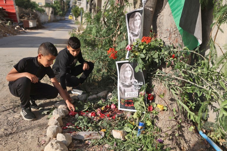 Children visit the site where veteran Al-Jazeera Palestinian journalist Shireen Abu Akleh was shot dead while covering an Israeli army raid in the occupied West Bank, in Jenin on May 12, 2022.