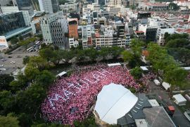 An aerial view showing the word 'majulah' meaning 'onward' spelt out in white amid a sea of pink balloons at Pink Dot in central Singapore