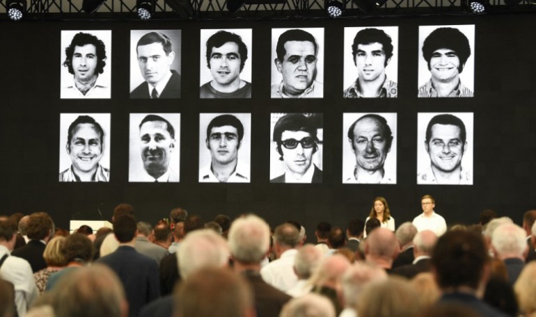 Portraits of the victims are displayed at the end of a ceremony to mark the 50th anniversary of an attack on the 1972 Munich Olympics