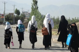 Girls walk to their school along a road in Gardez, Paktia porvince, on September 8, 2022. - Five government secondary schools for girls have resumed classes in eastern Afghanistan after hundreds of students demanded they reopen, provincial officials said on September 8.